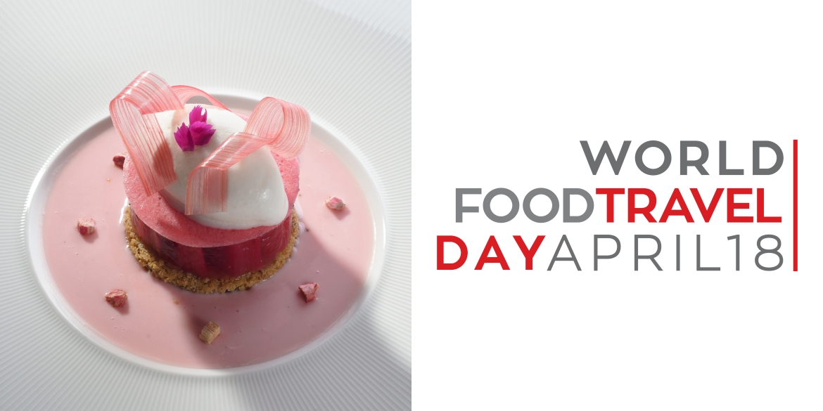 Rhubarb with rosemary ice cream and vanilla sauce, next to the World Food Travel Day logo
